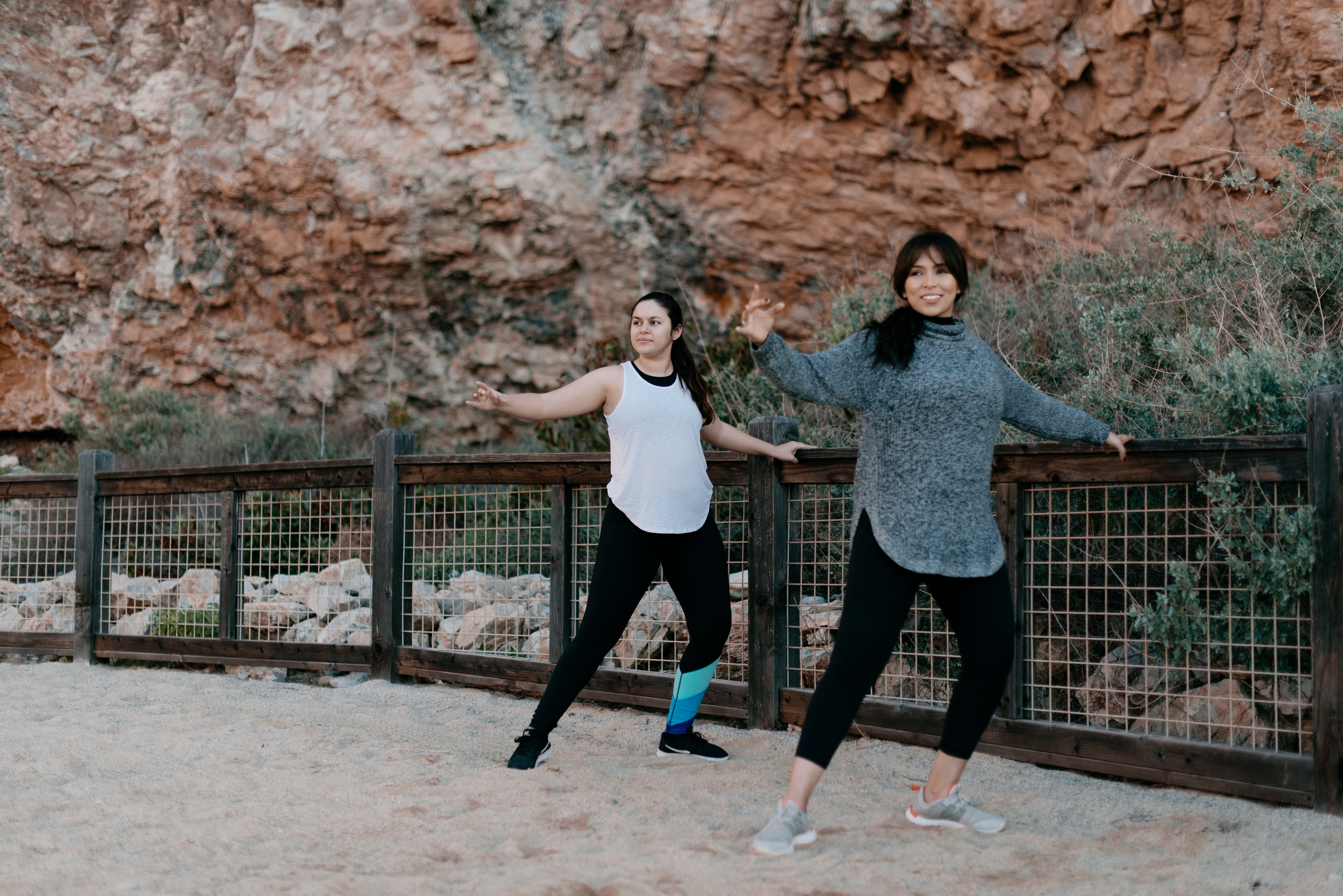two women warming up on the beach wearing Meleche or Meléche (short as (Mé)) sport clothes 